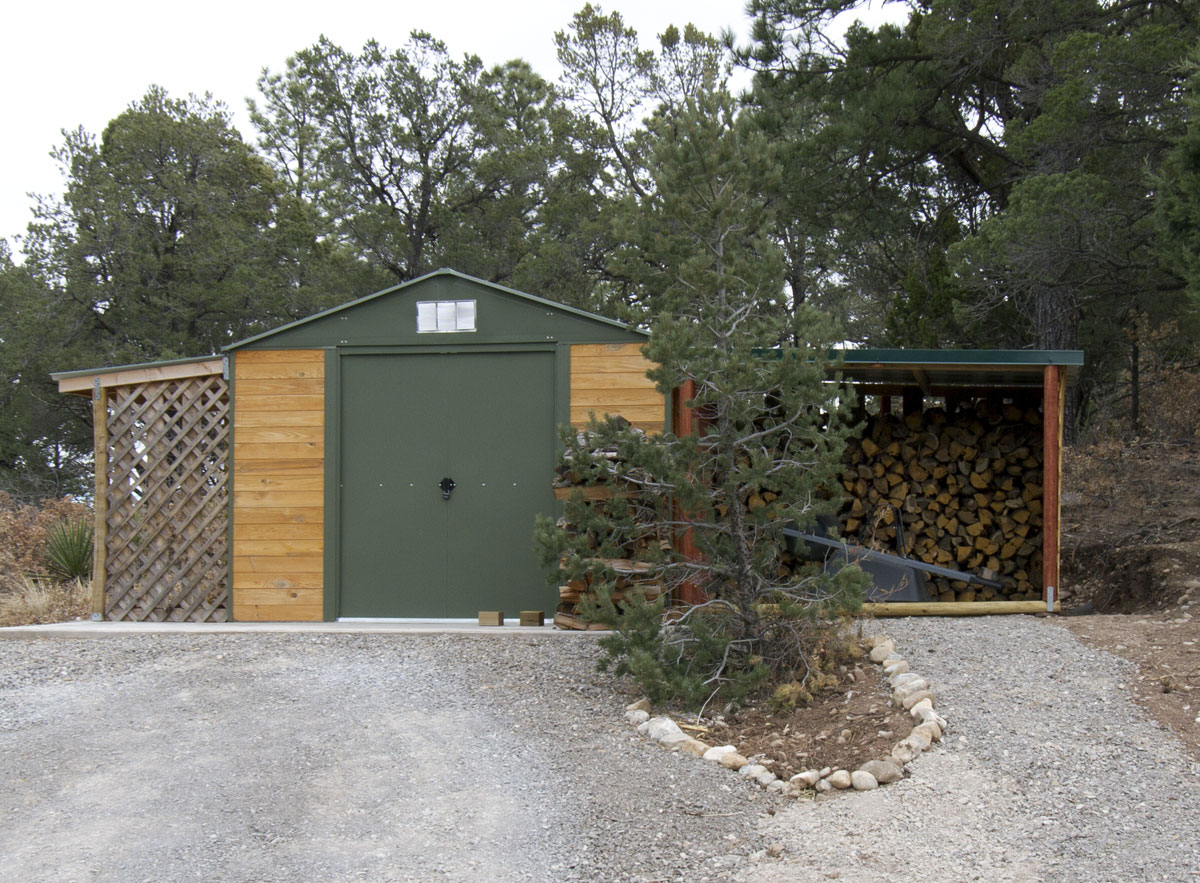 x10' storage shed with more open covered storage on each side, one 
